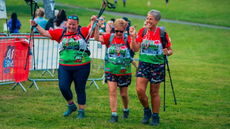 three people completing the gower peninsula challenge