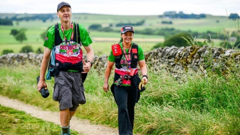 and man and woman hiking in the peak district