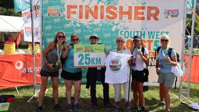 group of participants in the South West Coast 50 ultra challenge after finishing