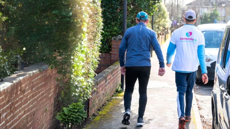 two fundraisers taking on 10,000 steps a day in June for Dementia UK. One is wearing a Dementia UK branded t-shirt