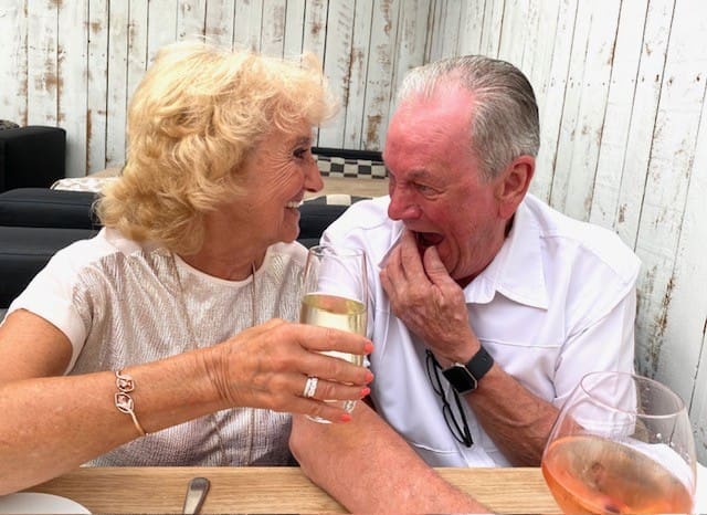 Sylvia and George exchange a laugh