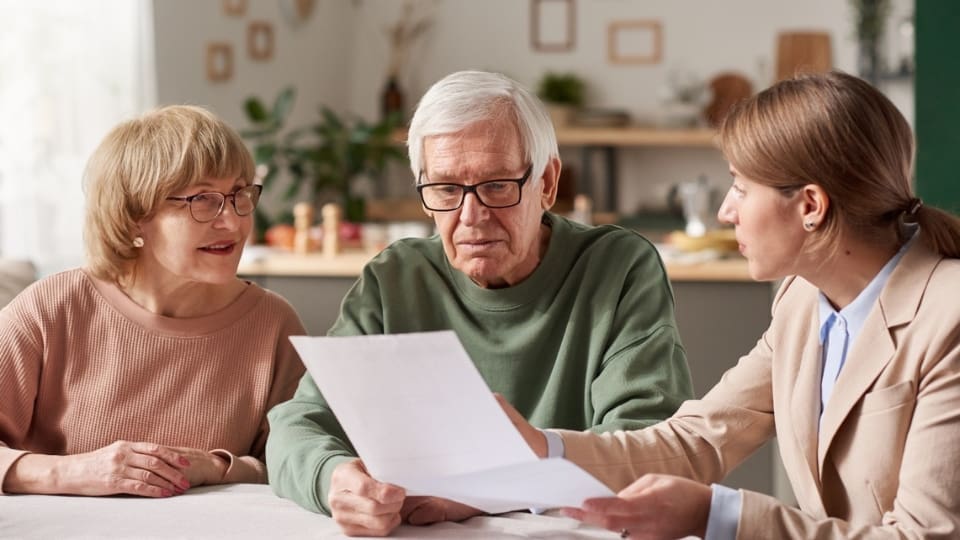 elderly man reading a document